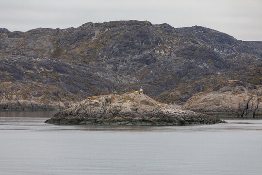 Yellow Lighthouse on an Island Near the Harbor of Nuuk, Greenland on a Cold Autumn Day