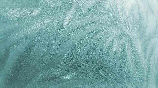 Rotating ice themed winter background of defocused soft swirling icy frost particle patterns naturally forming cold chilly frost pretty floral organic shapes in cold chilly cool icy white 4K animated