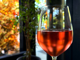 A glass of rose wine.