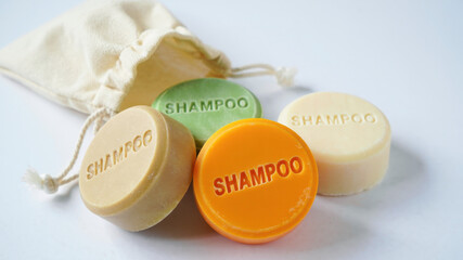 Solid shampoo bars with fabric travel pouch, eco-friendly toiletries for travel, waste-reducing personal care products, zero waste beauty alternative, sustainable bath essentials