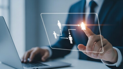 Businessman interacting with digital human resources interface on futuristic screen