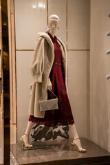 Mannequin Display with Elegant Red Dress and Coat