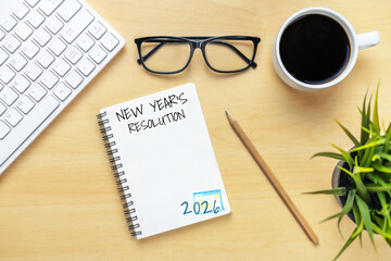 2026 Happy New Year Resolution Goal List and Plans Setting - Business office desk with notebook written about plan listing of new year goals and resolutions setting. Change and glee concept.