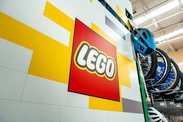 Fototapeta premium Lego logo poster in the supermarket toy section. The Lego Group brand, originated in Denmark. Guadalajara, Jalisco, Mexico, December 4, 2025.