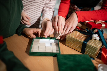 Family enjoying christmas holiday puzzle time together