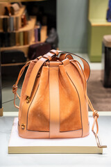 Elegant Suede and Leather Shoulder Bag Display