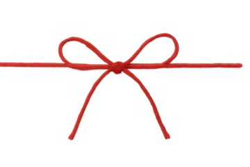 Red string bow on clear background creating a festive decoration for gifts, packages, and holiday celebrations, adding a touch of elegance