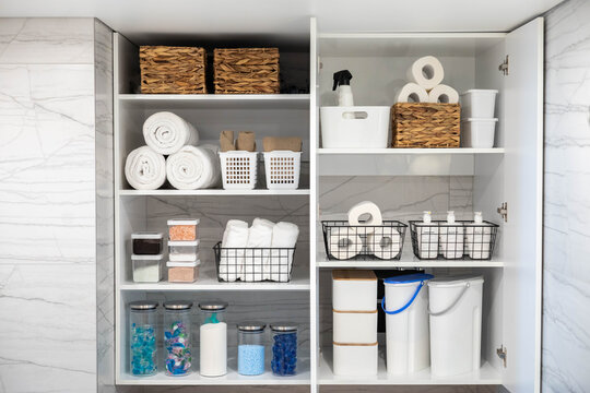 White bathroom laundry comfortable storage organizing arrangement on shelves eco style minimalism