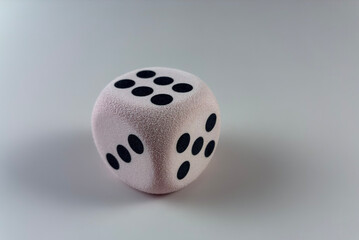 Minimalist Dice Concept Representing Chance, Opportunity, Business Risk and Decision Making with Soft Pink Foam Dice 