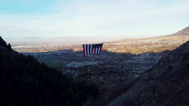 4K Aerial Views of The Major Large American Flag Hanging in Mountains of North Ogden Utah Veterans Day - Coldwater Creek Canyon 