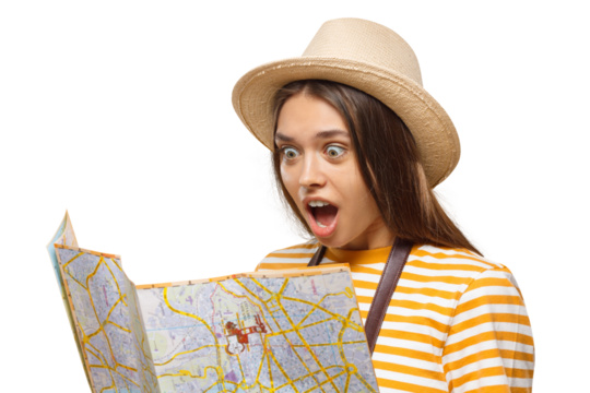 Amazed young woman tourist looking at paper map with mouth open