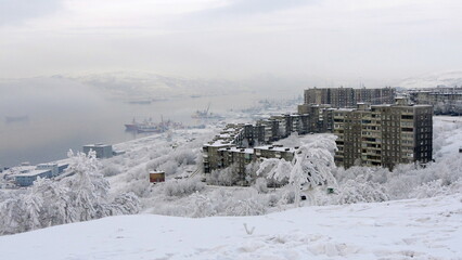 A typical day at the seaport on a frosty winter day. Kola Bay. Trees and bushes are covered in snow and frost.