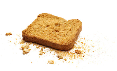 Close up crumbs and slice whole wheat dry integral bread with wholewheat flour isolated on white background, side view