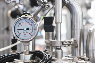 Medical pharma production machine with many tubes and other devices in pharmaceutical factory, pharmaceutical medical production concept background.