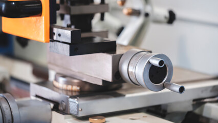 Ball screw drives for CNC machines on blue tone.