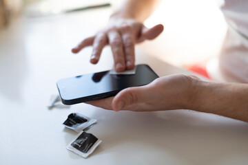 The process of replacing a protective glass on a smartphone