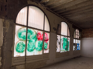 Abandoned building windows with graffiti art