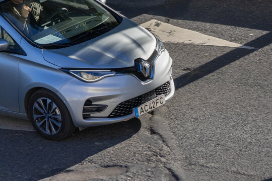 Renault zoe electric car driving on asphalt street