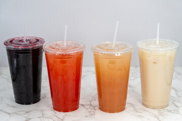 Tasty choice of sweet drinks of various colors including Jamaica lemonade, guava, strawberry, and horchata to quench that thirst