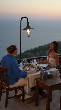 A couple enjoying a romantic dinner together in a warm and intimate atmosphere, capturing love, connection, and elegant holiday dining moments.