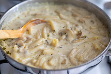Close-Up of Creamy Mushroom Pasta Cooking in a Pan