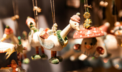 Unusual Christmas tree decorations: funny geese in hats, glitter-covered snowmen and mushrooms