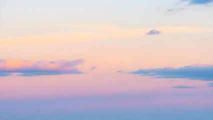 Obraz premium Captivating pastel sky at dawn or dusk, featuring a serene and tranquil gradient of soft pink, purple, and blue hues with wispy clouds, creating a peaceful natural backdrop