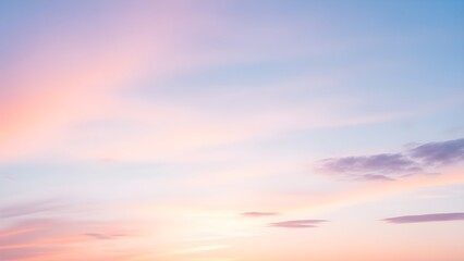 Serene pastel sky at dawn or dusk, featuring soft, blended clouds in shades of pink, blue, and orange. Ethereal gradient offers a tranquil atmosphere for peaceful contemplation