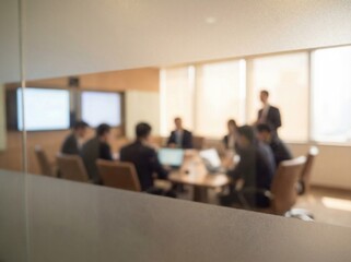 Dynamic blurred view of business colleagues collaborating in a brightly lit modern meeting room.