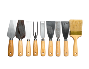 Assortment of diverse tools, arranged against a stark black backdrop. Close-up, overhead view