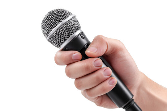 Person holds a microphone in one hand ready to speak or perform in a clear setting with no background distractions - Powered by Adobe