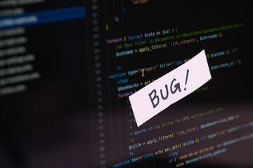 "BUG!" Warning Sticky Note on Programming Code