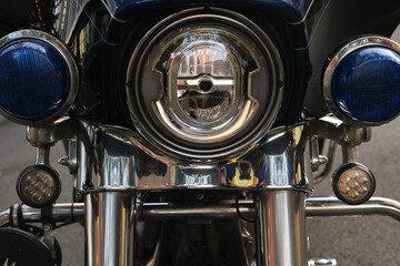 Fototapeta premium Close-up of the headlights of a vintage motorcycle.