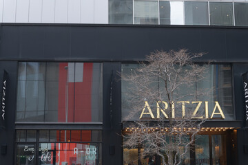 Fototapeta premium facade and sign of Aritzia, a women's clothing store, located at 50 Bloor St W, Holt Renfrew Centre, Toronto