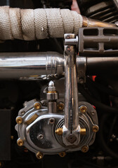 Close-up of the pedals of a vintage motorcycle.