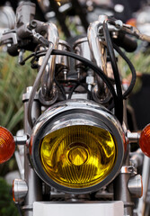 Close-up of the headlights of a vintage motorcycle.