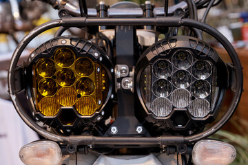 Close-up of the headlights of a vintage motorcycle.