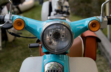 Close-up of the headlights of a vintage motorcycle.