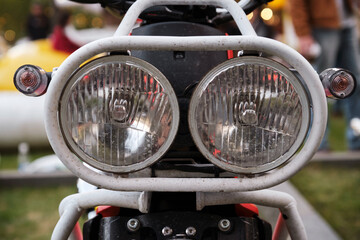 Close-up of the headlights of a vintage motorcycle.