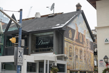 Fototapeta premium exterior of Dimmi Bar & Trattoria located at 140 Cumberland St, Toronto