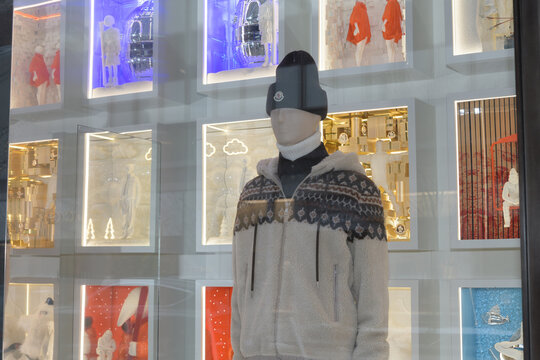 display window with mannequin inside Moncler, a clothing store, located at 131 Bloor St W, Toronto