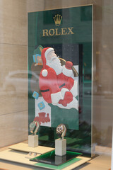 Fototapeta premium hand‑crafted holiday display by Rolex’s Roldeco studio, featuring festive Santa Claus figure in leather and fabric at Rolex Boutique at Royal de Versailles Jewellers, 101 Bloor St W, Toronto