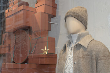 Naklejka premium holiday display window with male mannequin at Loro Piana, a clothing store, located at 111 Bloor St W, Toronto