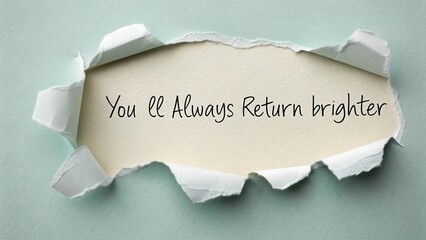 Torn Paper with Handwritten Text Saying You Will Always Return Brighter, Positive Message, Inspirational Concept