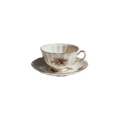 Delicate vintage porcelain teacup with floral decal and gold trim on matching saucer, soft shadow and elegant scalloped rim conveying graceful nostalgic mood