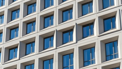 Modern Building Facade with Repeating Window Patterns and Geometric Design.