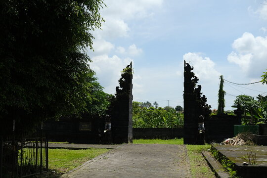 Split Balinese Candi Bentar Gates Against Bright Sky