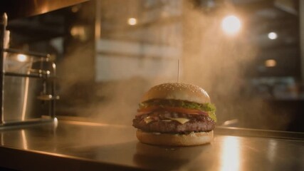 Cinematic slow-motion shot of a freshly prepared gourmet cheeseburger steaming on a professional kitchen counter