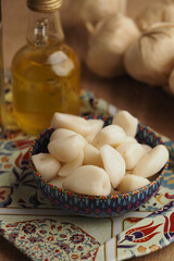 Garlic and oil on a patterned kitchen plate