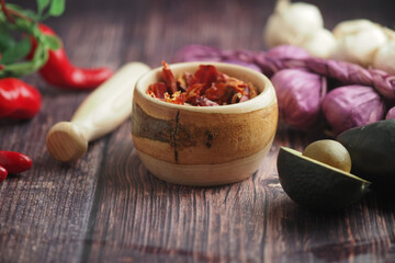 Cooking ingredients on a wooden surface with spices